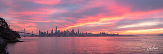 Panorama of the San Francisco skyline from the Bay Bridge to the Golden Gate with a spectacular pink sunset taken from Treasure Island, CA.