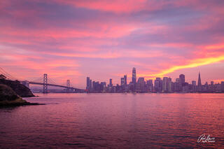 A rare, magical pink sunset of the San Francisco skyline from Treasure Island, CA. 