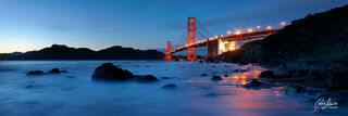 An award winning panoramic fine art image of the Golden Gate Bridge in San Francisco at low tide at dusk