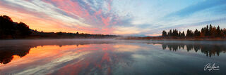 Horizontal Panoramic fine art image of a beautiful sunrise with reflection at Oxbow Bend in Grand Tetons National Park, Wyoming