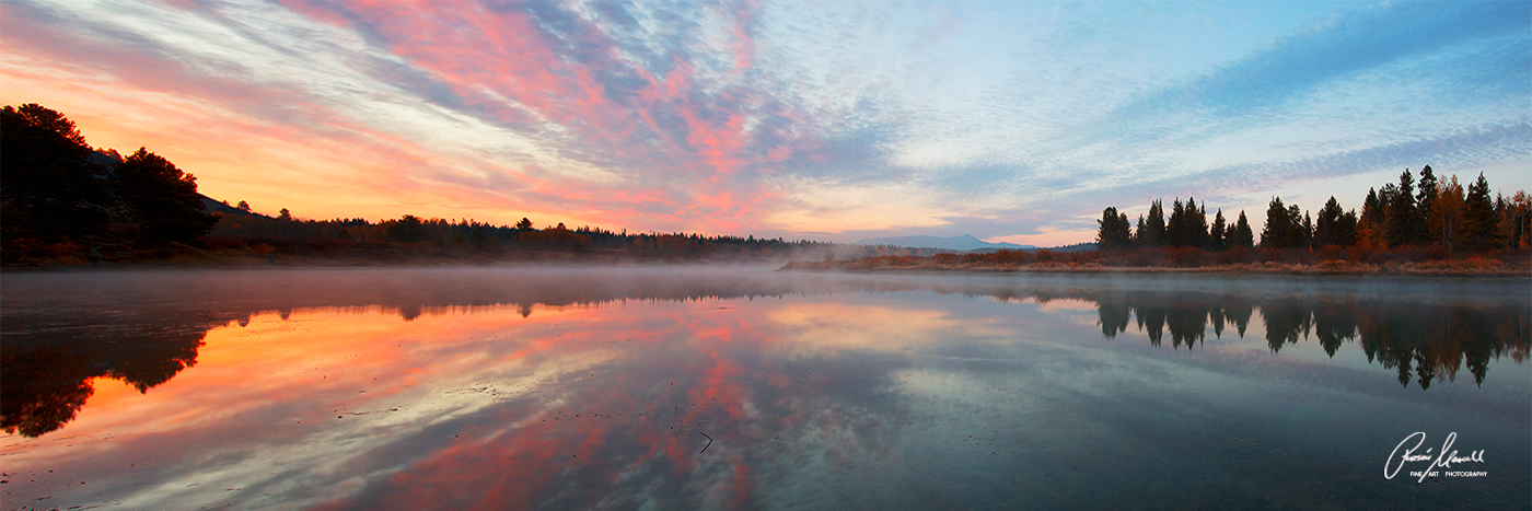 Horizontal Panoramic fine art image of a beautiful sunrise with reflection at Oxbow Bend in Grand Tetons National Park, Wyoming